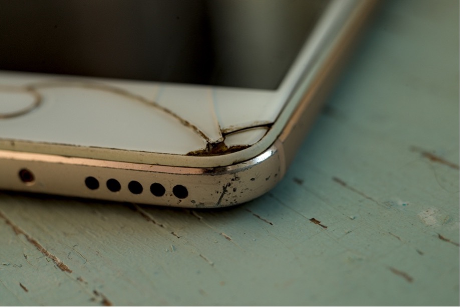 A close up of a cracked mobile phone