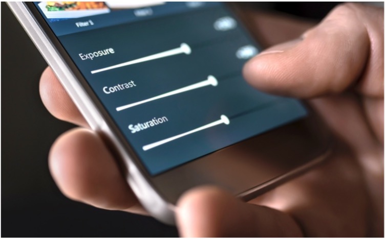 Close-up of a person's hand holding a phone